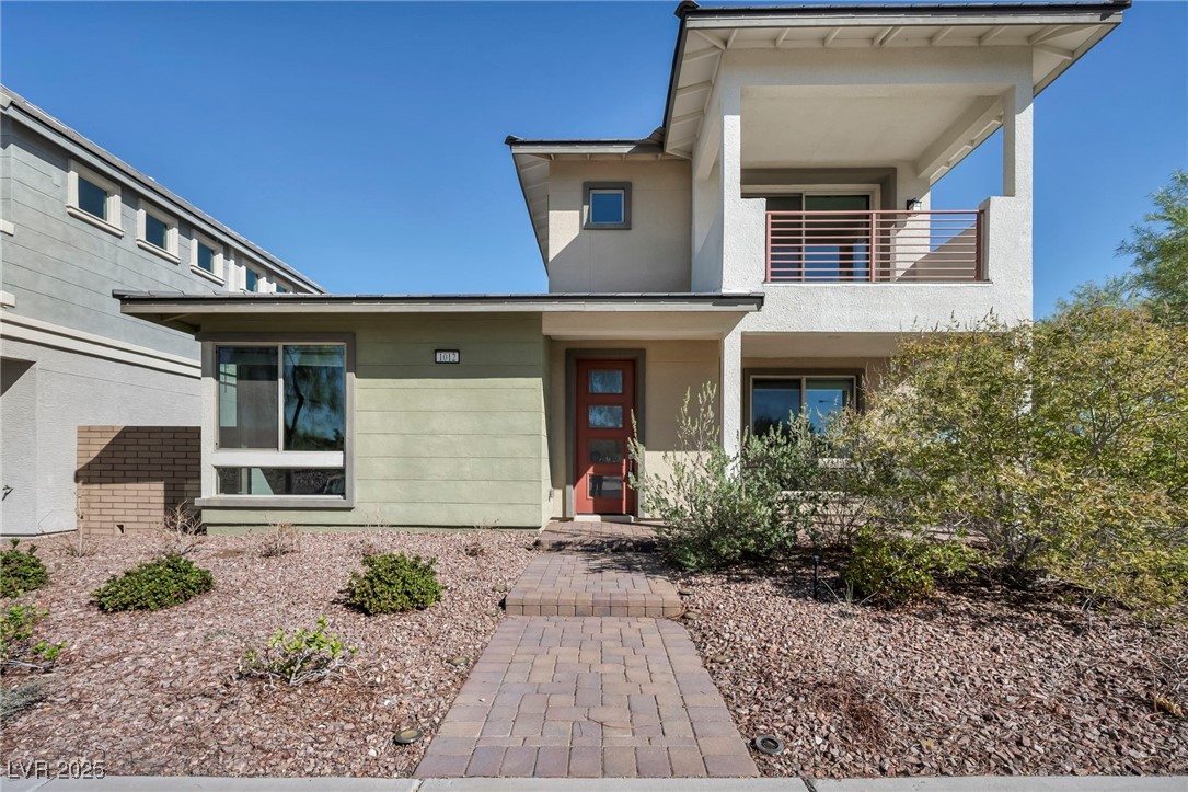 Property entrance with stucco siding
