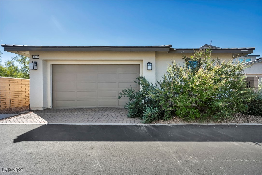 1012 East Sunset Road Henderson, NV 89011 - Photo 15 of 77 Garage featuring driveway