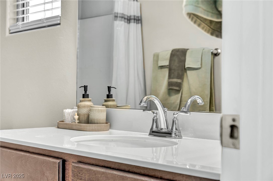 1012 East Sunset Road Henderson, NV 89011 - Photo 31 of 77 Bathroom view of vanity and a shower with shower curtain