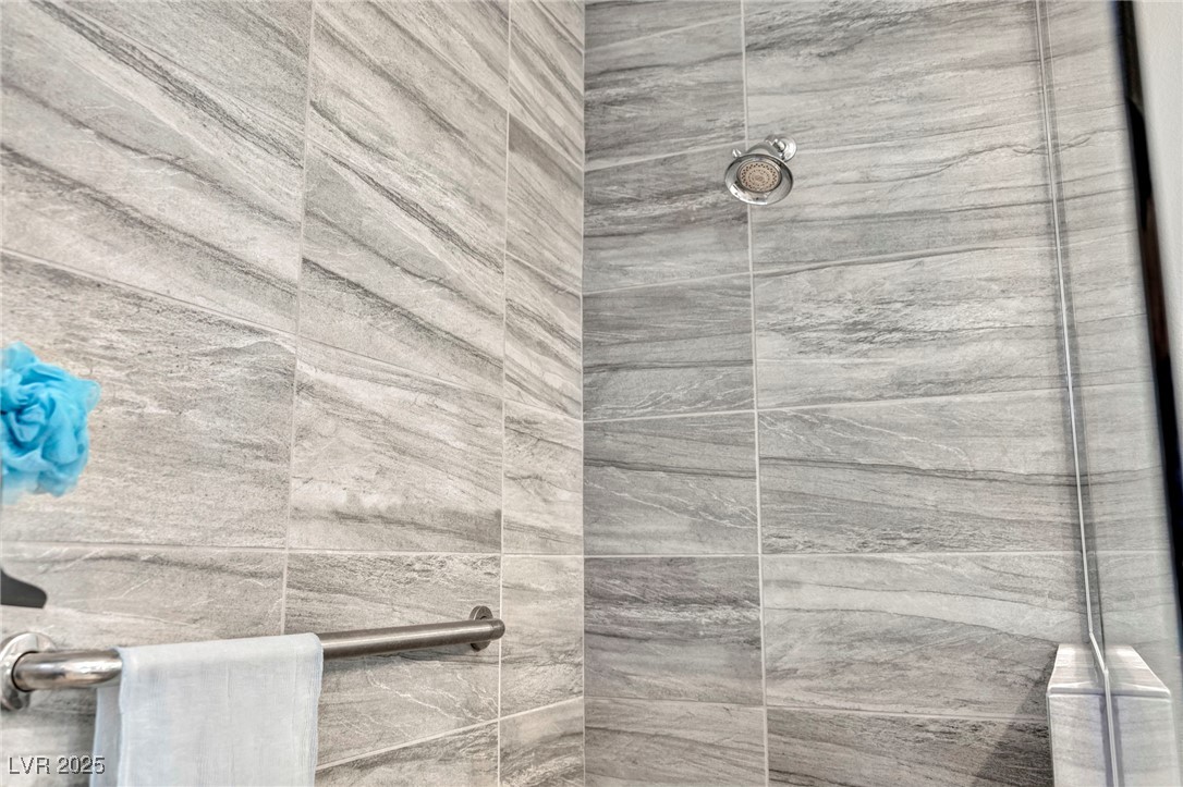 1012 East Sunset Road Henderson, NV 89011 - Photo 32 of 77 Full bath featuring a tile shower