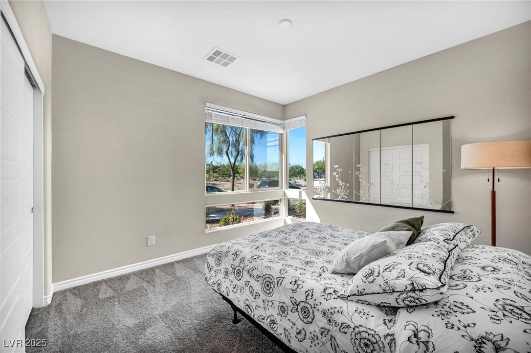 1012 East Sunset Road Henderson, NV 89011 - Photo 33 of 77 Carpeted bedroom with baseboards