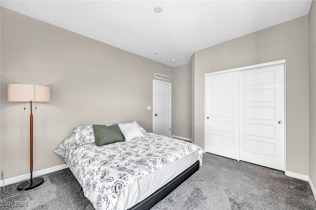 1012 East Sunset Road Henderson, NV 89011 - Photo 35 of 77 Bedroom with carpet floors and a closet