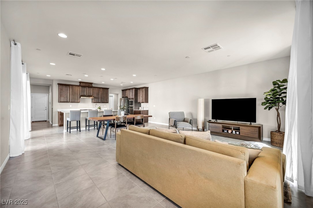 1012 East Sunset Road Henderson, NV 89011 - Photo 37 of 77 Living room with recessed lighting and light tile patterned floors