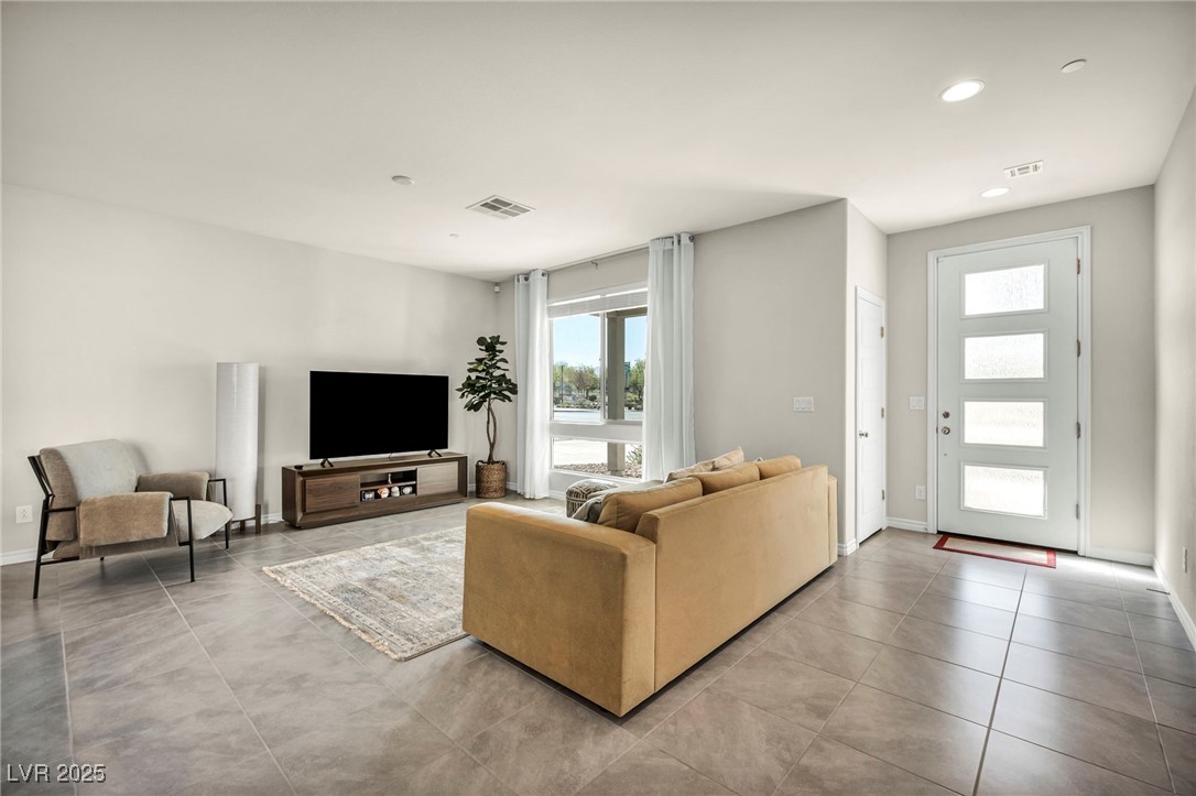 1012 East Sunset Road Henderson, NV 89011 - Photo 38 of 77 Living room with recessed lighting and tile patterned flooring