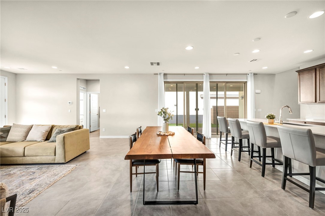 1012 East Sunset Road Henderson, NV 89011 - Photo 42 of 77 Dining room featuring recessed lighting and baseboards