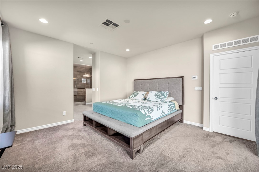 1012 East Sunset Road Henderson, NV 89011 - Photo 55 of 77 Bedroom featuring recessed lighting, ensuite bathroom, and light carpet