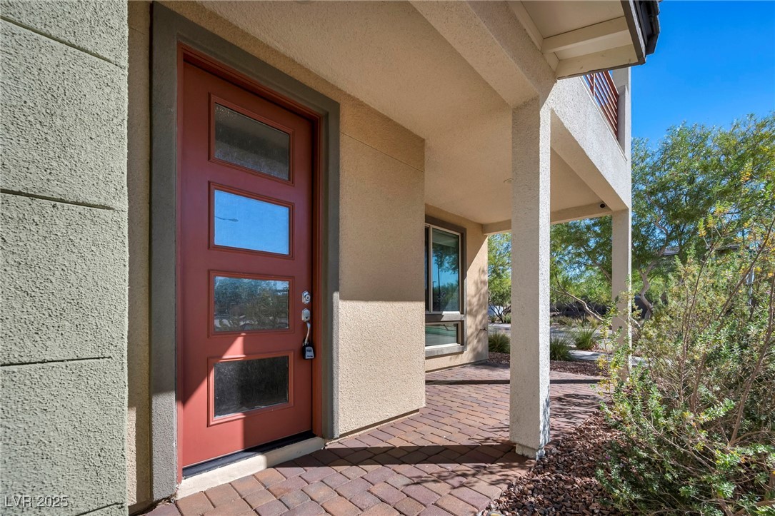 1012 East Sunset Road Henderson, NV 89011 - Photo 6 of 77 Entrance to property featuring a patio area and stucco siding