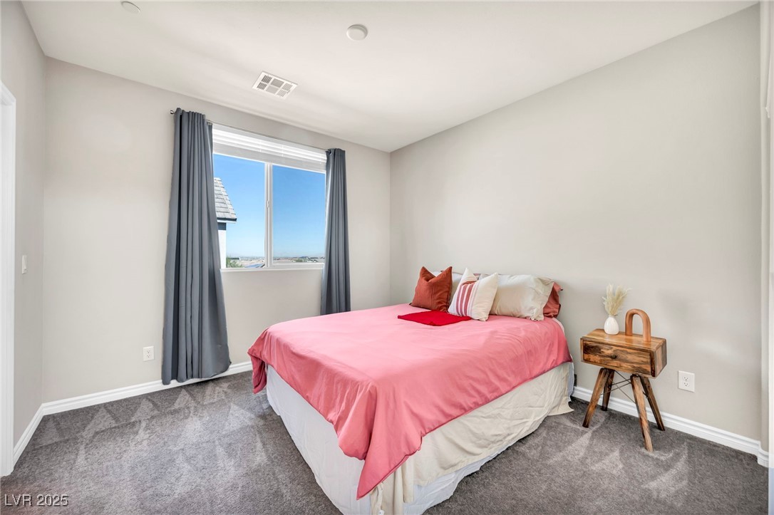 1012 East Sunset Road Henderson, NV 89011 - Photo 64 of 77 Carpeted bedroom featuring baseboards