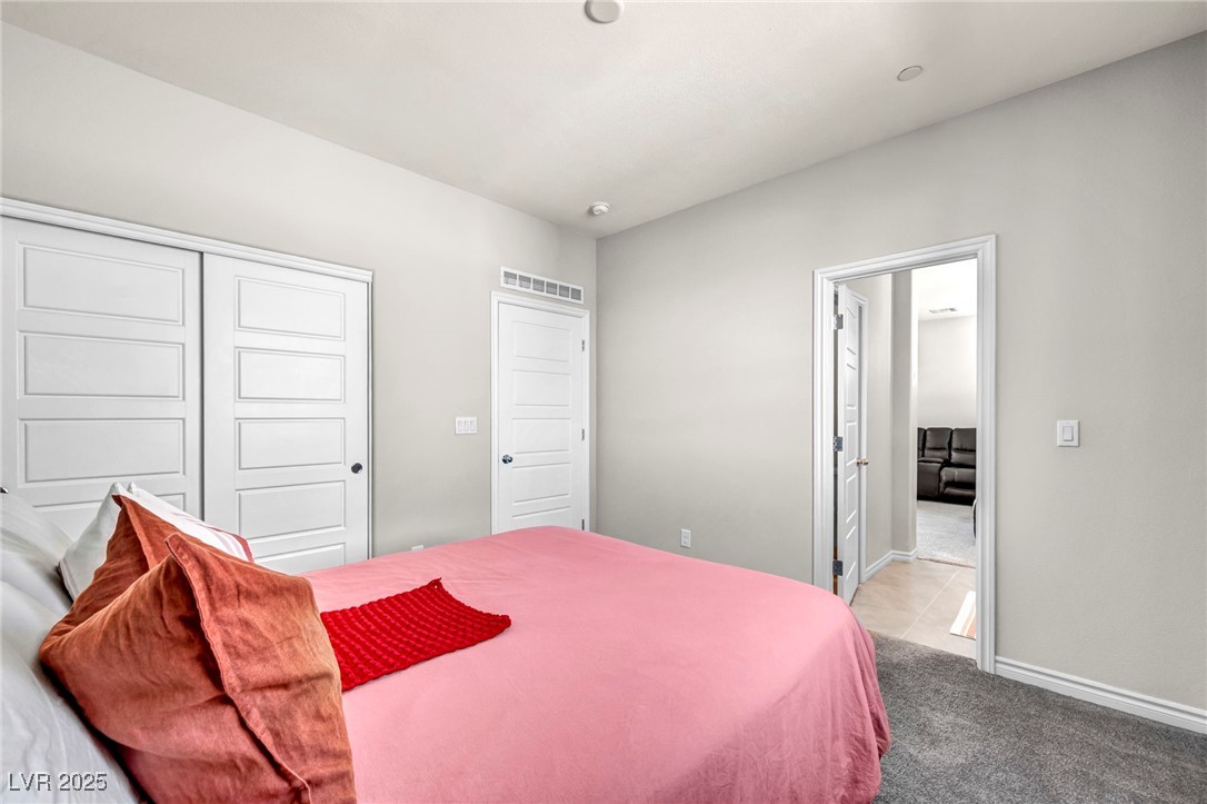 1012 East Sunset Road Henderson, NV 89011 - Photo 66 of 77 Bedroom with a closet and carpet floors
