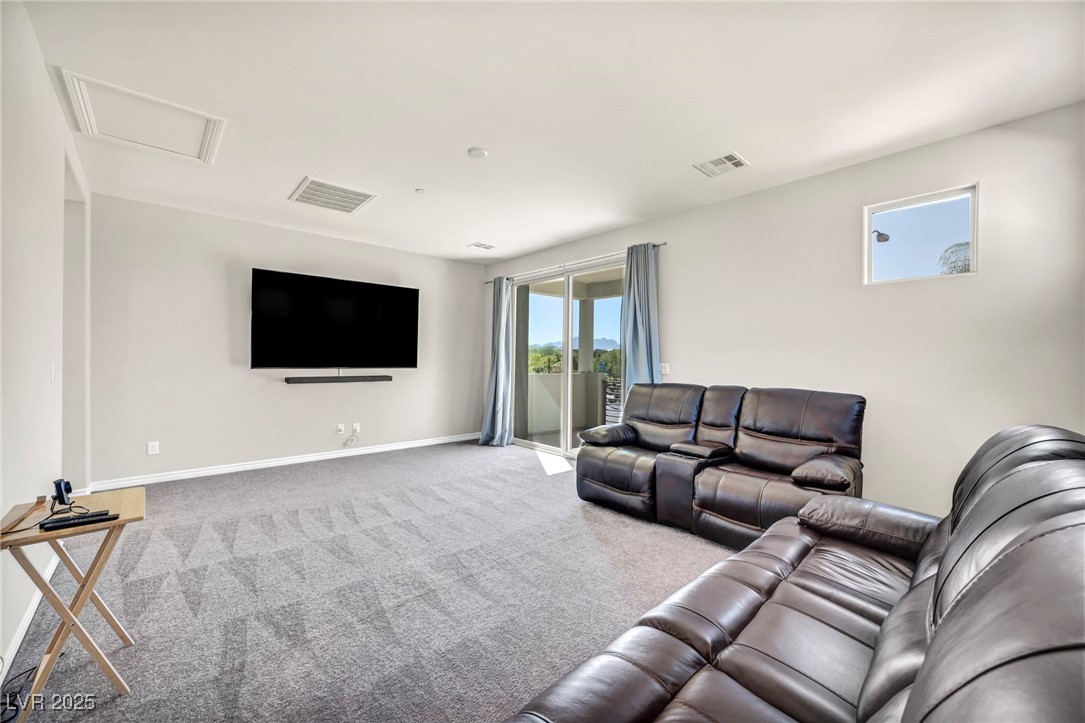 1012 East Sunset Road Henderson, NV 89011 - Photo 69 of 77 Carpeted loft with attic access and baseboards