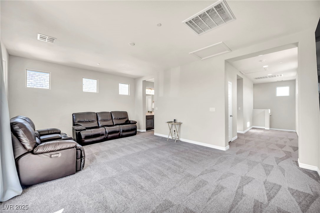 1012 East Sunset Road Henderson, NV 89011 - Photo 71 of 77 Loft area featuring attic access and light colored carpet