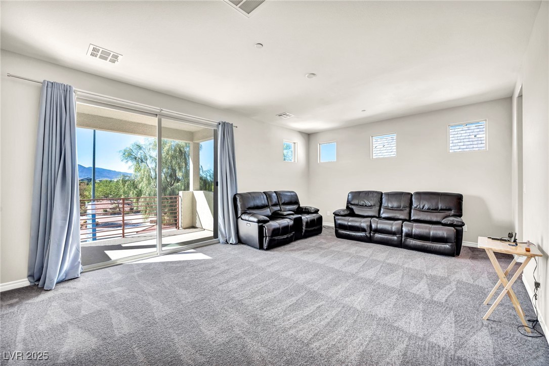 1012 East Sunset Road Henderson, NV 89011 - Photo 72 of 77 Carpeted loft featuring baseboards and a mountain view