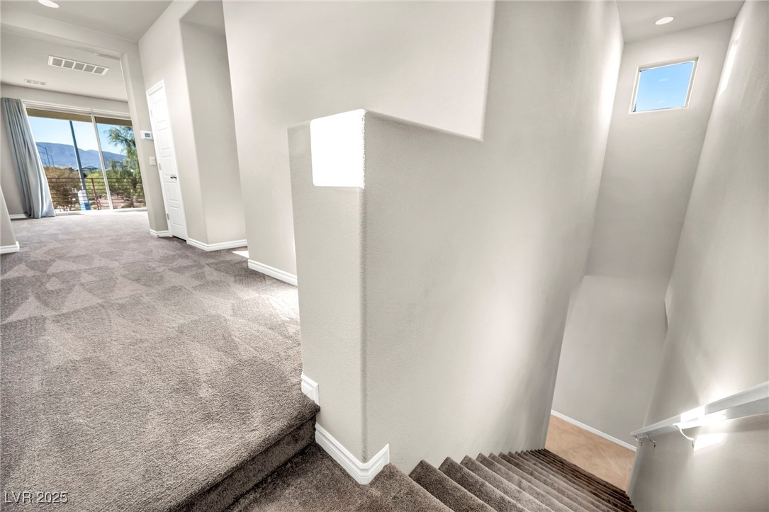 1012 East Sunset Road Henderson, NV 89011 - Photo 73 of 77 Hallway featuring carpet flooring, a mountain view, and recessed lighting
