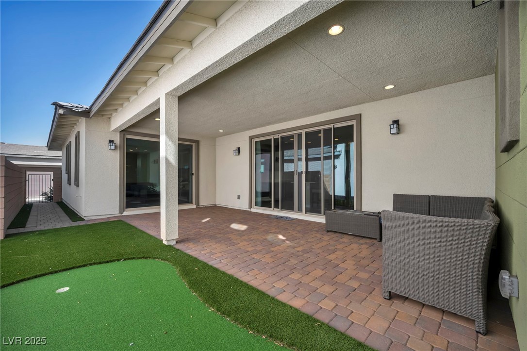 1012 East Sunset Road Henderson, NV 89011 - Photo 9 of 77 View of patio featuring a putting green