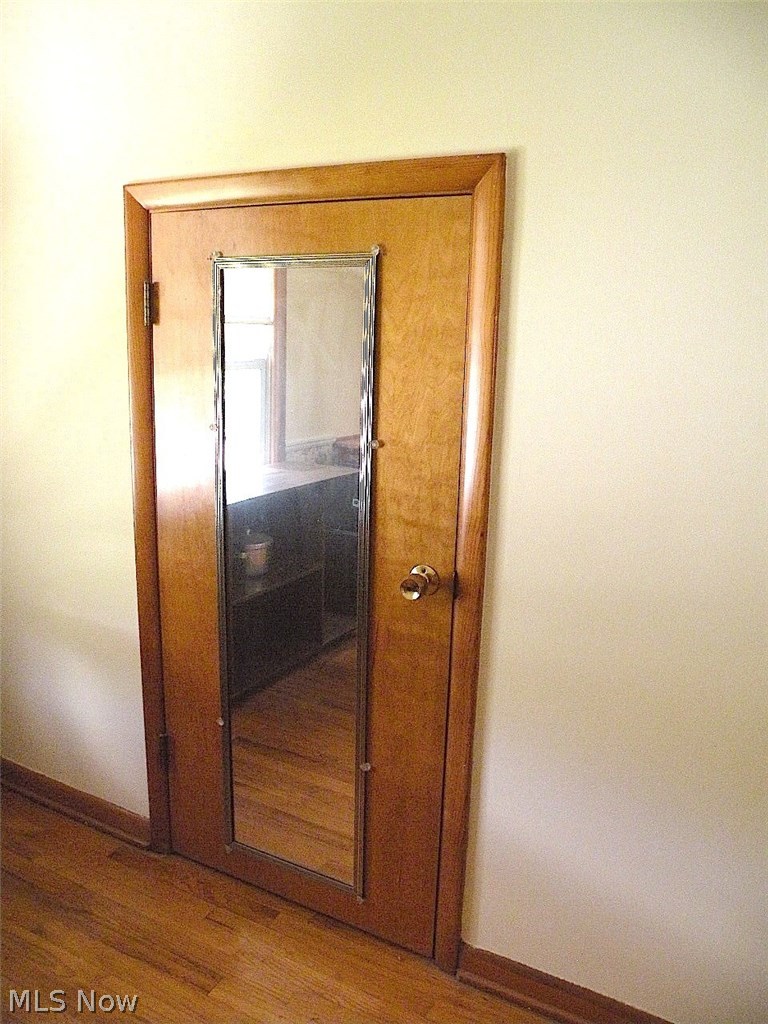 403 Rutland Street Akron, OH 44305 - Photo 19 of 26 Extra storage; A mirror to make sure on looks their best before descending downstairs.