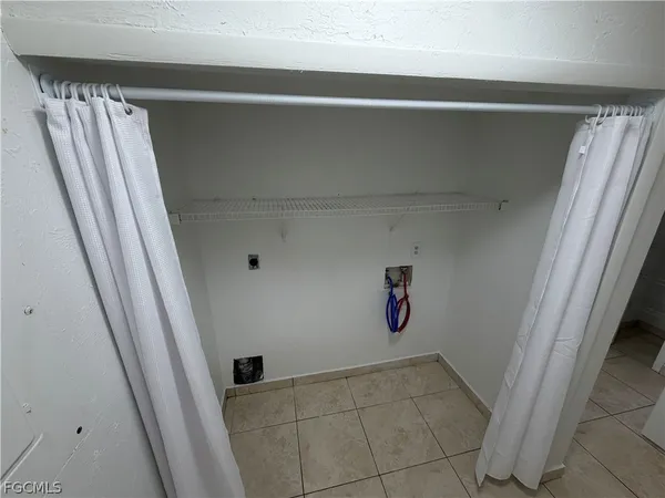 a view of an empty room with windows