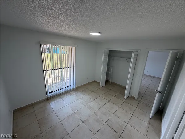 a view of a hallway with a bathroom