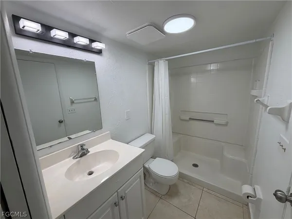 a view of a bed in a room