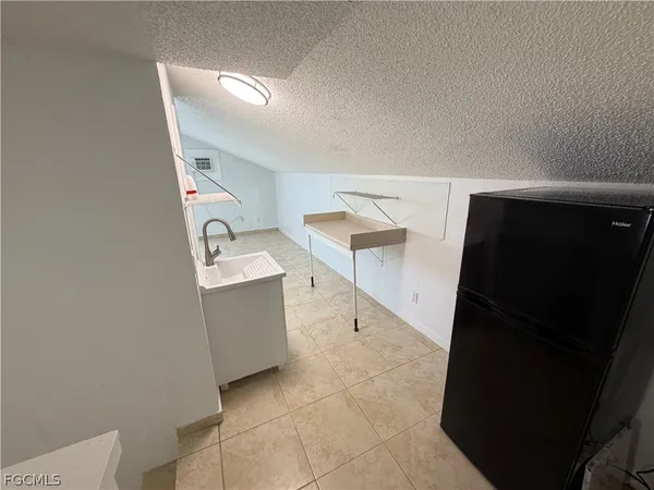 a view of kitchen and utility room