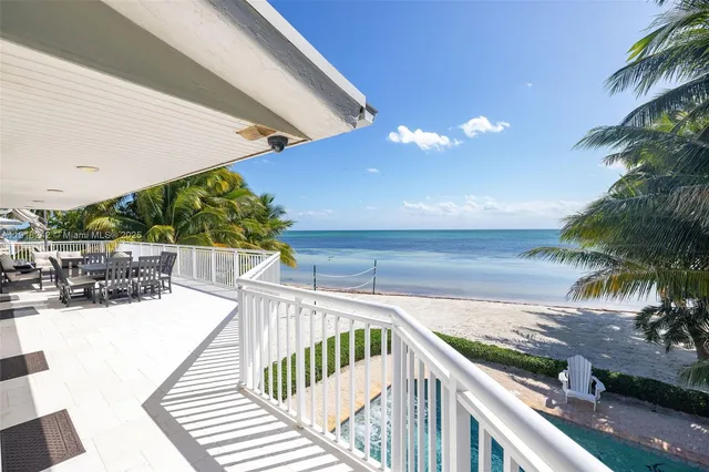 a kitchen with stainless steel appliances granite countertop a stove sink and microwave
