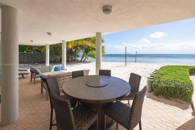 an aerial view of a house with outdoor space