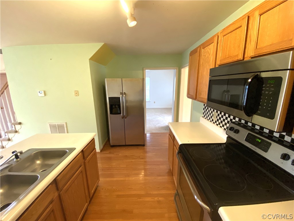 5137 Hackney Road Richmond, VA 23234 - Photo 11 of 43 a kitchen with a sink appliances and cabinets