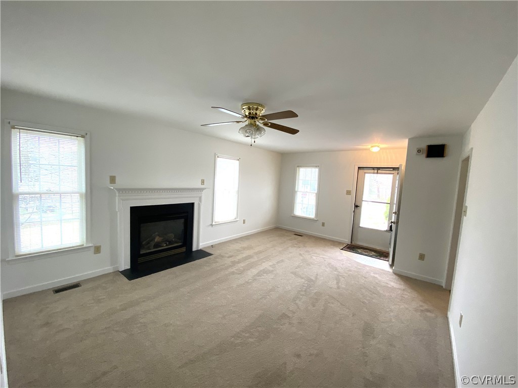 5137 Hackney Road Richmond, VA 23234 - Photo 3 of 43 an empty room with a fireplace and window