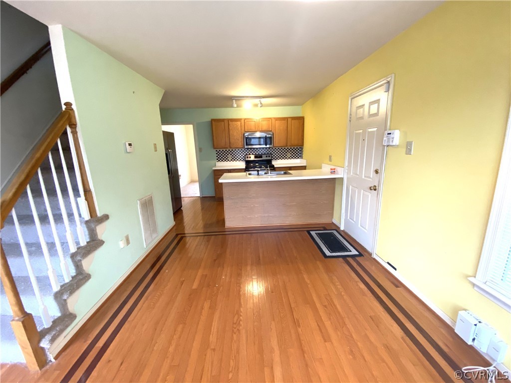 5137 Hackney Road Richmond, VA 23234 - Photo 9 of 43 a view of kitchen with wooden floor and electronic appliances