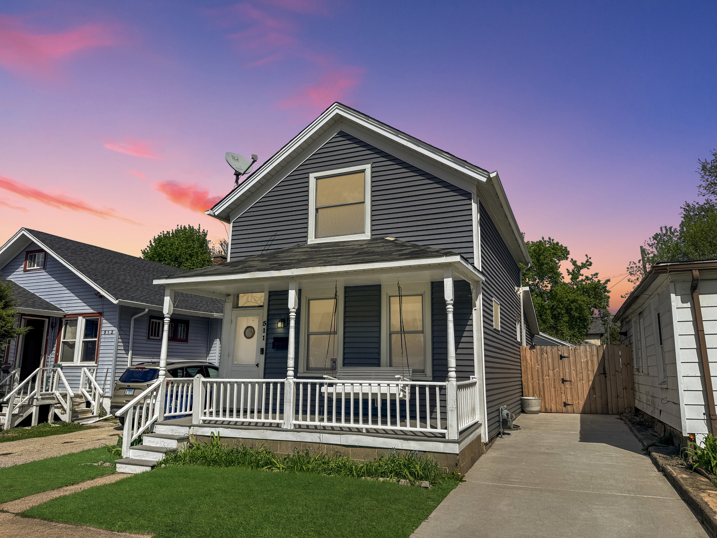 a front view of a house with a garden