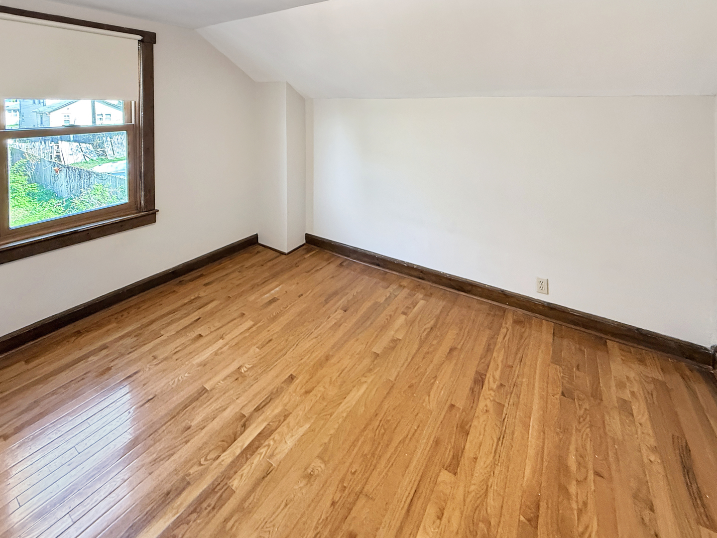 511 Chestnut Street Waukegan, IL 60085 - Photo 12 of 17 a view of empty room with wooden floor and fan