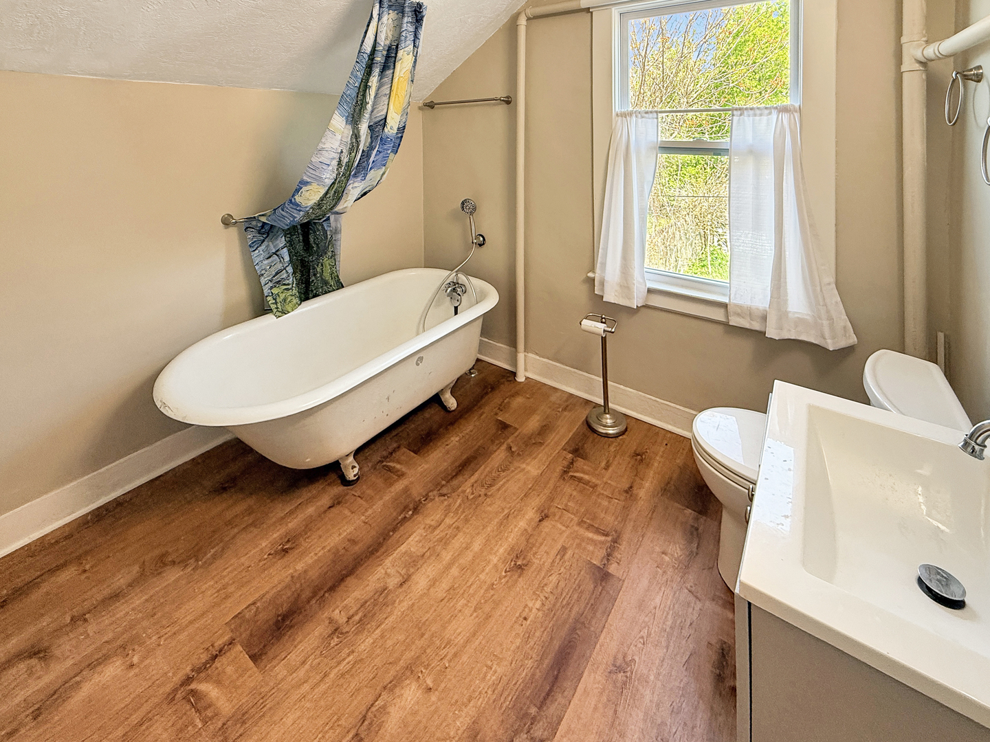 511 Chestnut Street Waukegan, IL 60085 - Photo 13 of 17 a bathroom with a sink and a toilet