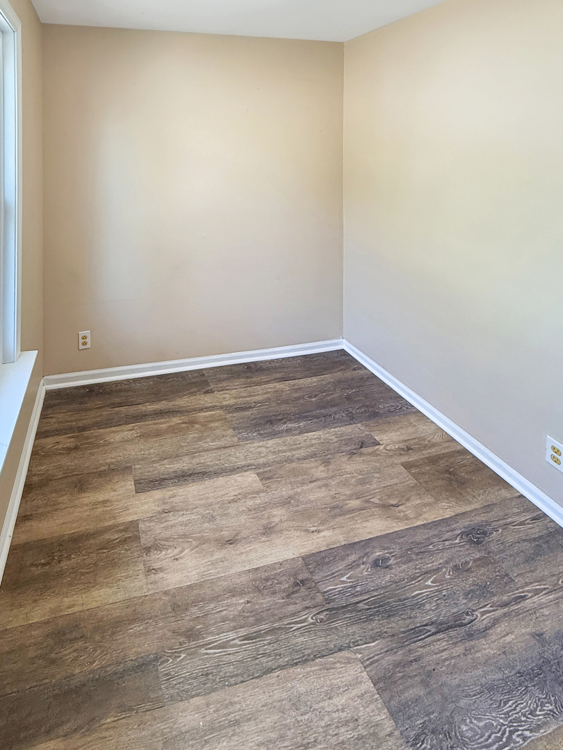 511 Chestnut Street Waukegan, IL 60085 - Photo 8 of 17 a view of empty room with wooden floor