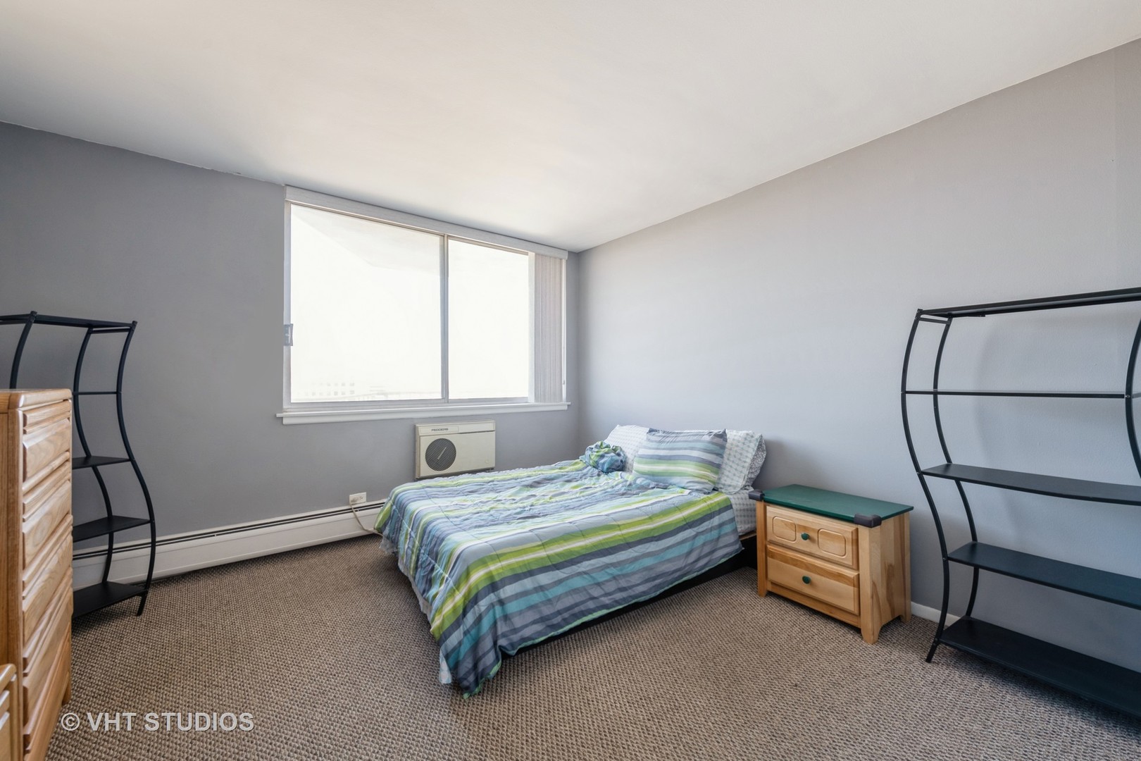 40 North Tower Road, Unit 14A Oak Brook, IL 60523 - Photo 11 of 18 a bedroom with a bed and a window