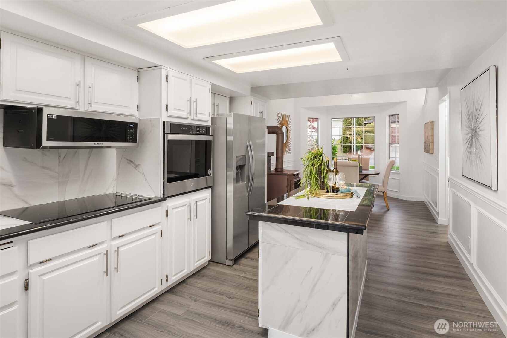 2805 Cedar Avenue South Renton, WA 98055 - Photo 19 of 40 a kitchen with stainless steel appliances a stove microwave and refrigerator