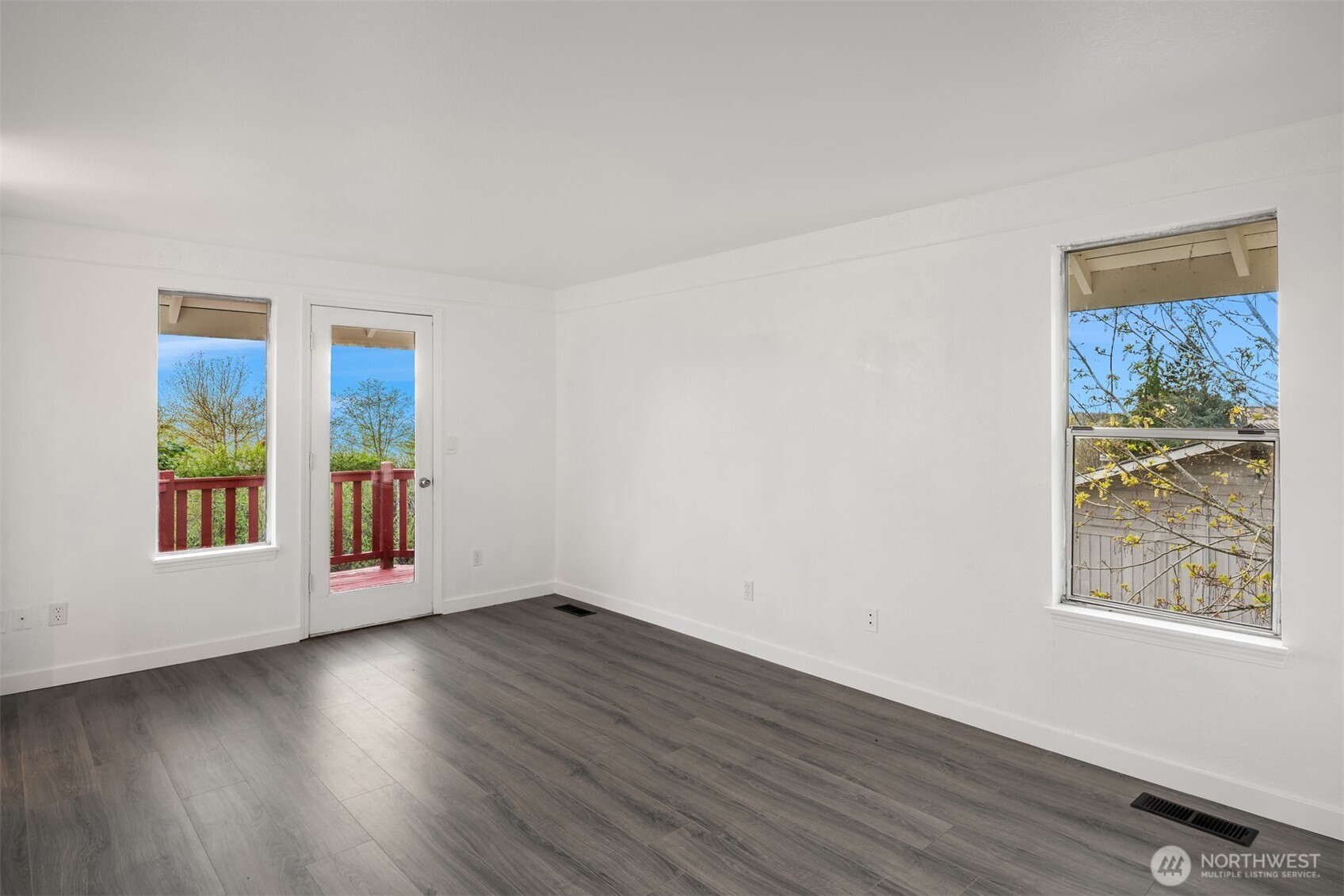 2805 Cedar Avenue South Renton, WA 98055 - Photo 23 of 40 a view of an empty room with wooden floor and a window