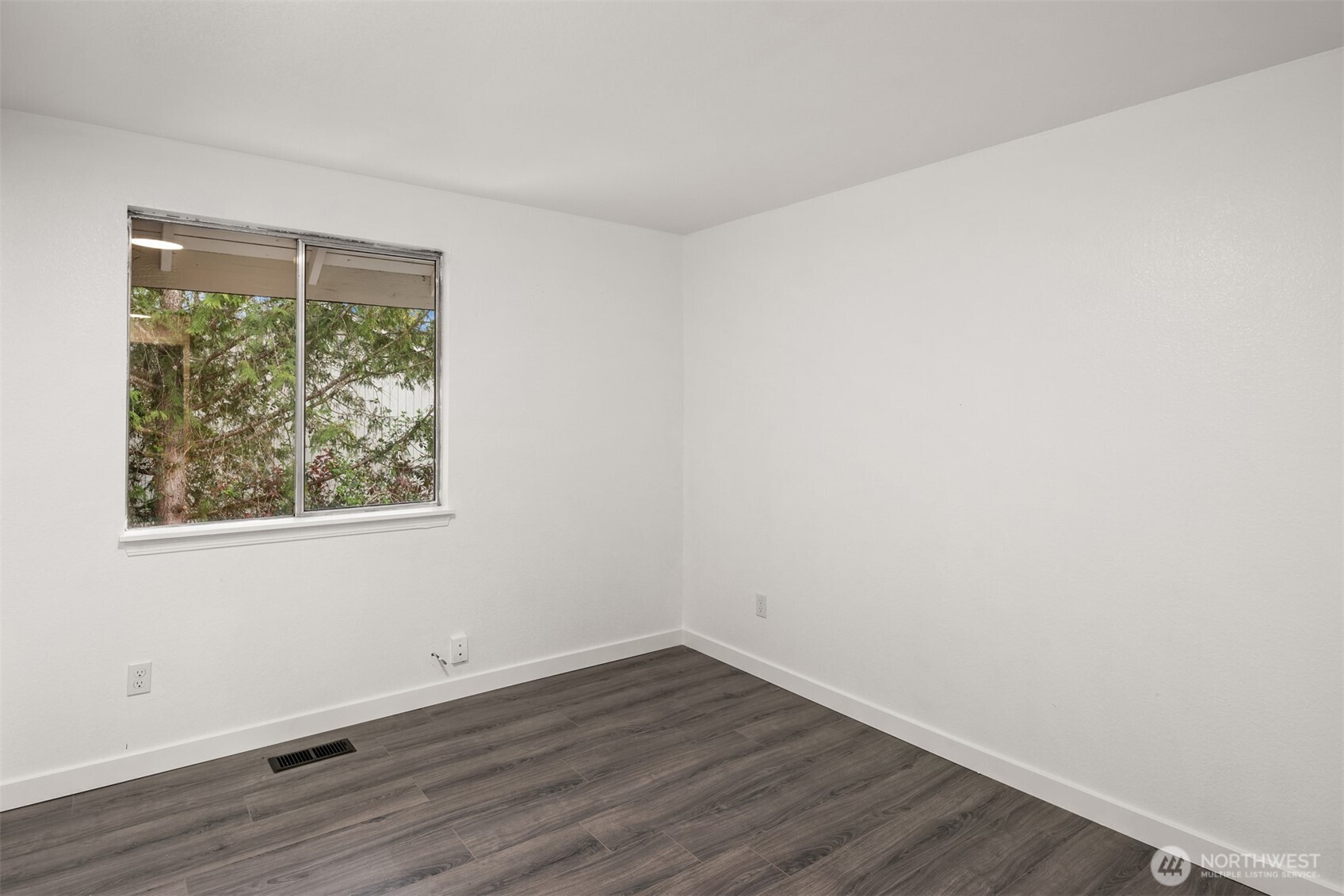2805 Cedar Avenue South Renton, WA 98055 - Photo 29 of 40 a view of an empty room with wooden floor and a window