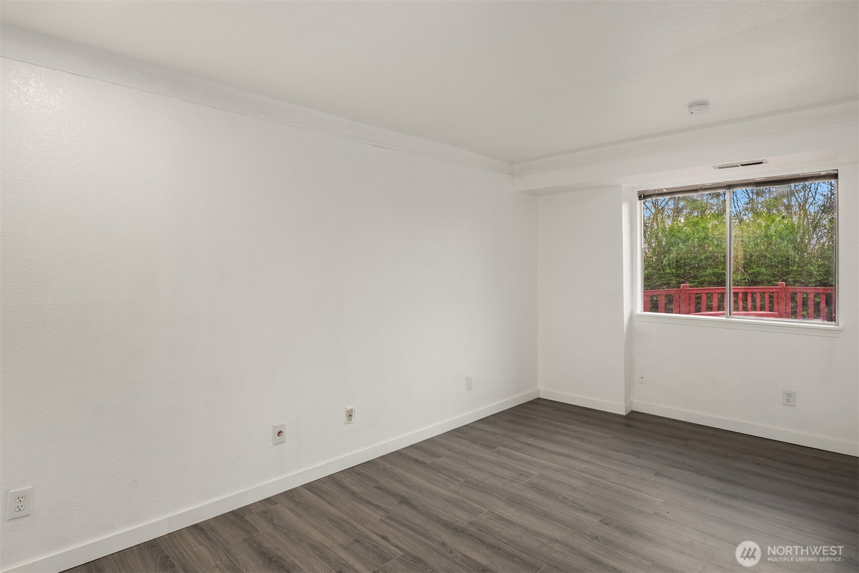 2805 Cedar Avenue South Renton, WA 98055 - Photo 32 of 40 an empty room with wooden floor and windows