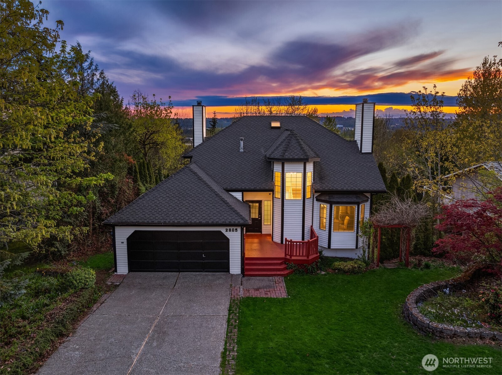 2805 Cedar Avenue South Renton, WA 98055 - Photo 4 of 40 a front view of a house with a garden and yard