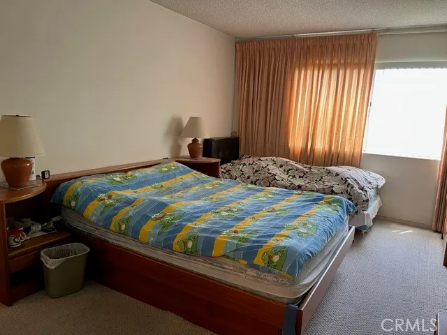 a view of a table and chairs under an umbrella