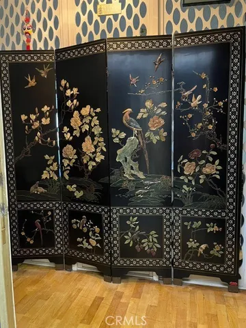 a view of a balcony with wooden fence