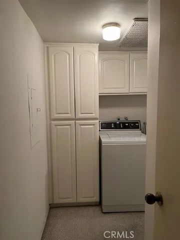 a room with a wooden floor and shoes