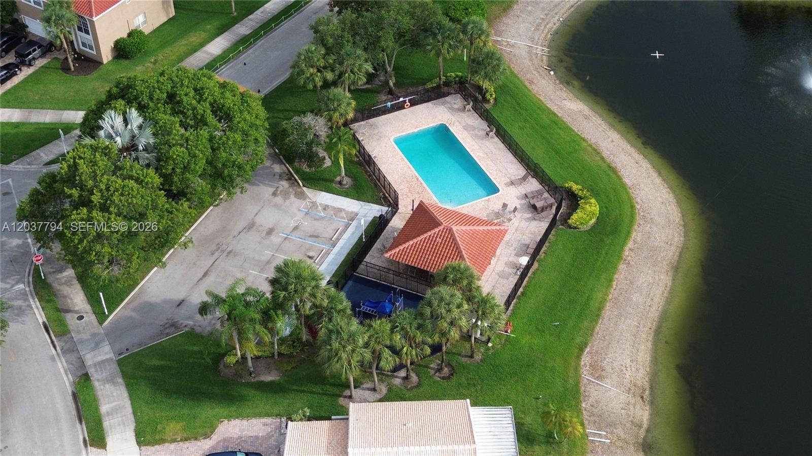 10180 Fanfare Drive, Unit 10180 Boca Raton, FL 33428 - Photo 31 of 33 Community Pool & Tot-Lot