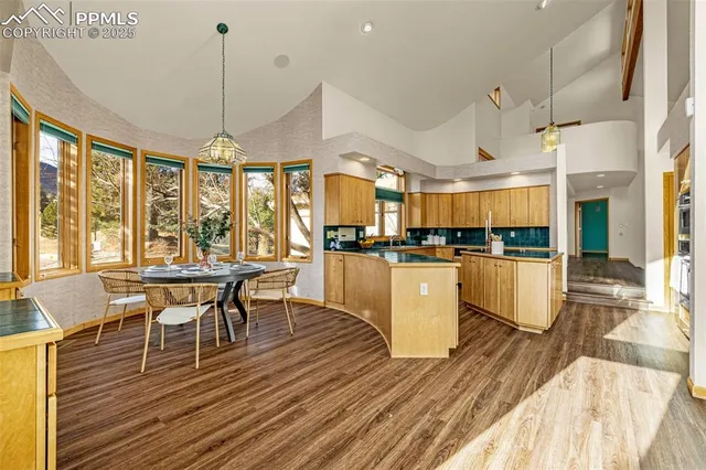 a kitchen with a table and chairs in it
