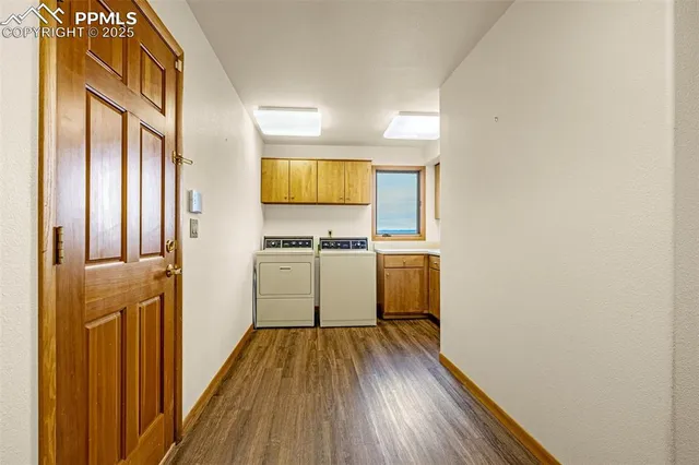 a view of a kitchen with wooden floor