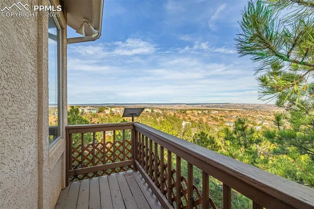 a view of a balcony with wooden floor