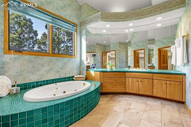 a view of an empty room with cabinet and a window