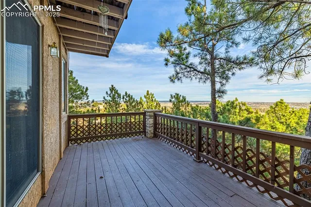 a view of a balcony with wooden floor