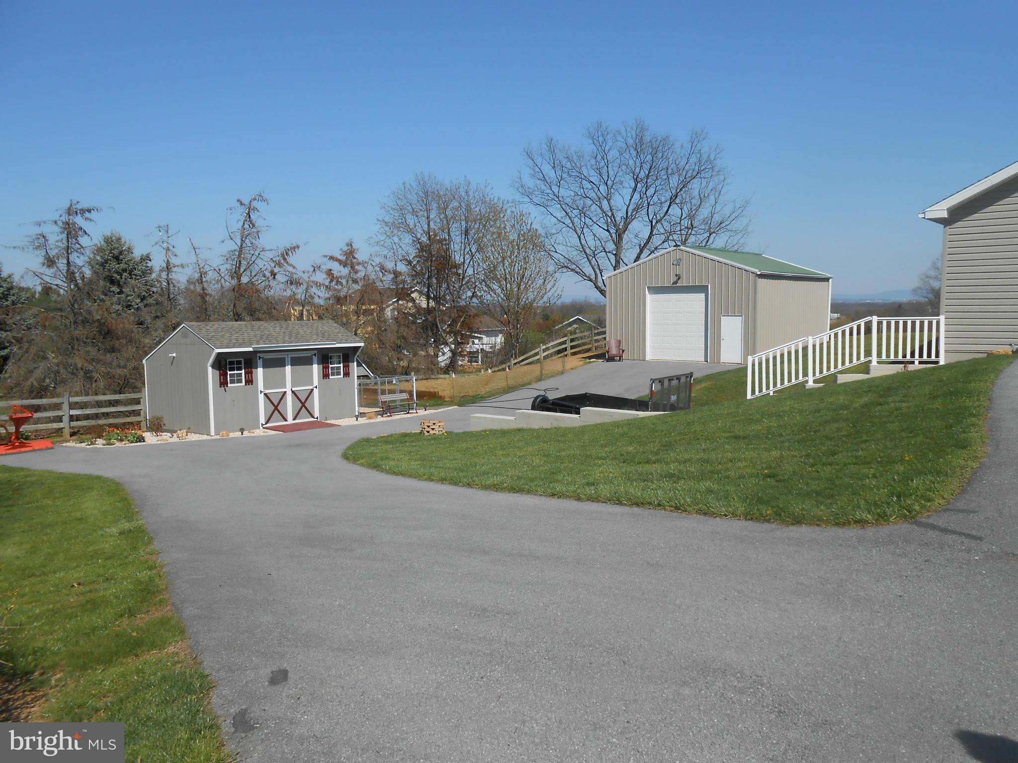 Paved driveway provides tons of parking
