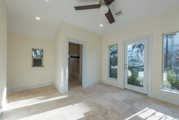 a view of an empty room with glass door