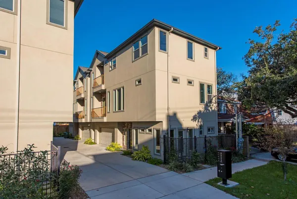 a front view of a building with garden